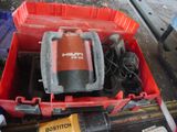 a red box with a red and black machine inside of it