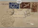 an old envelope with stamps on it on a table