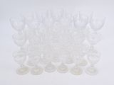 a lot of empty wine glasses sitting on a table