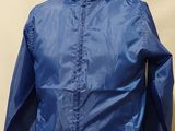 the back of a mannequin wearing a blue jacket and jeans