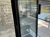 a glass door with a sign on it that says orangina