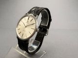 a watch that is sitting on a stand on a table