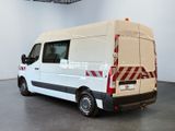 a white van with red stripes parked in a room