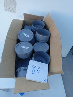 a box full of plastic containers sitting on the ground