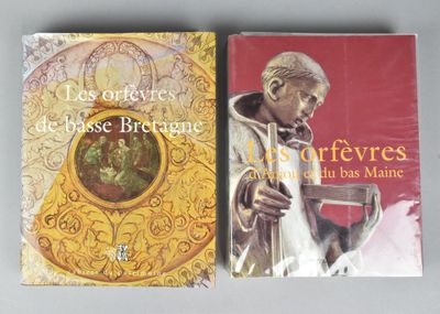 two books on a table with a picture of a man in a priest ' s robe and a picture of a man in a priest ' s robe