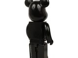 a black bear figurine on a white background