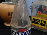 a bottle of water sitting on a table next to other bottles
