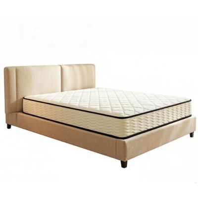 the bed frame is made of beige fabric and has a mattress on it