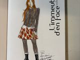 a drawing of a woman wearing a skirt and boots
