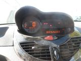 a car dashboard with a digital clock on it