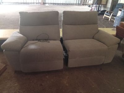two recliners that are sitting next to each other