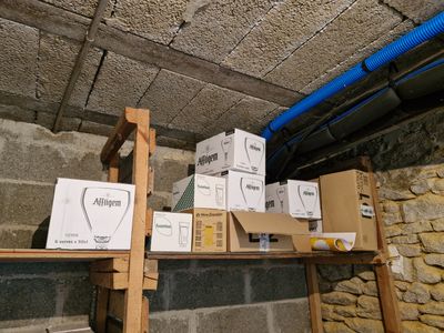 many boxes on the shelves in the room