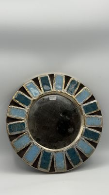 a close up of a ring with a stone in the center