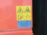 a sign on the back of a red truck