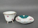 a close up of a cup and saucer on a table