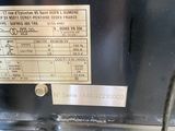 a label on the back of a machine that is sitting on a table