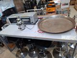 a pan sitting on a table in the middle of a room