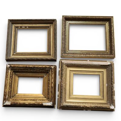 four antique gold picture frames on a white background
