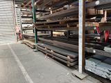 a lot of metal shelves in a storage area