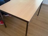 a person sitting at a table in a living room