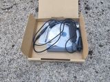 a box with a computer mouse in it sitting on the ground