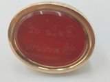 a close up of a red object on a white surface