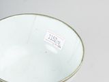 a blue and white bowl sitting on a table