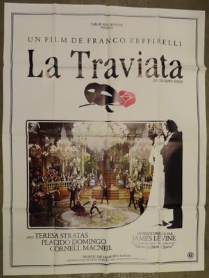 the poster for la traviata is hanging on the wall