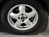 a close up of a tire on a car ' s rim