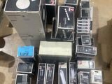 many boxes of electronic equipment on the floor