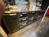 a kitchen with a lot of appliances on the counter