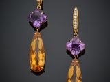 une paire de boucles d'oreilles en améthorate et diamants