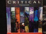 the box of the game critical is shown next to the box of the game