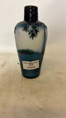 a blue and white vase sitting on a table
