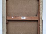 an old wooden easel with a piece of paper on top of it