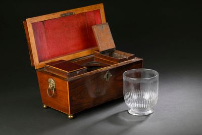 a glass and a wooden box with a glass in it