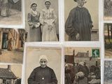 many old photos of people and animals on the wall