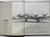 an open book with a picture of a plane on it
