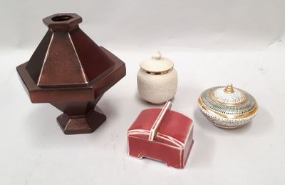 three small vases sitting next to each other on a table