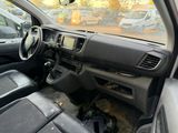 a dashboard of a car that is parked in a parking lot