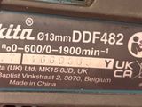 a close up of a makita df452 cordless drill