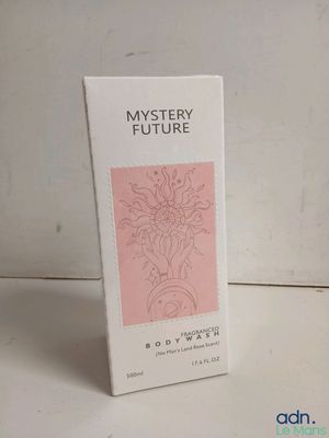 an image of a box of perfume sitting on top of a table
