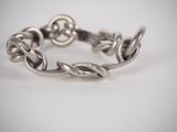 an image of a silver bracelet on a white background