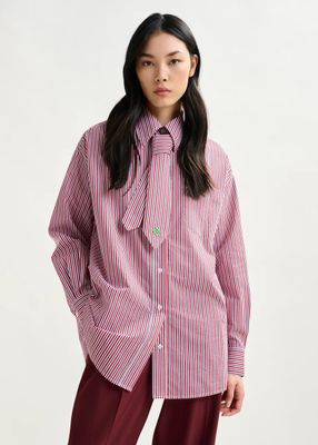 a woman wearing a red and white striped shirt with a bow tie