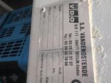 a picture of a sign on a wall near a blue machine