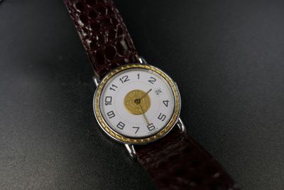an image of a close up of a wrist watch on a table