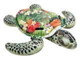 une statue représentant une tortue avec des fleurs sur le dos