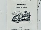 un livre sur lequel figure la photo d'un homme et d'une femme assis sur un banc