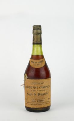 an old bottle of wine sitting on top of a white surface