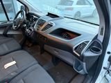a view of the inside of a car from the driver ' s seat